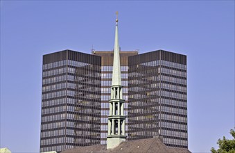 Top of Essen Cathedral, with the town hall behind it. With a height of 106 metres and 69, 000