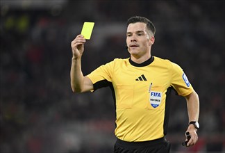 Referee Harm Osmers shows yellow card yellow caution. Gesture Gesture MHPArena, MHP Arena