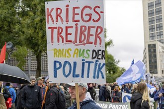 War-mongers out of politics poster at the Lay down your arms demonstration at Breitscheidplatz in