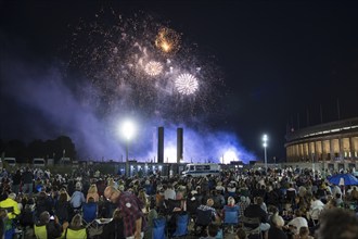 Spectators watch the fireworks at the Pyronale on the Maifeld at the Olympic Stadium, Berlin,