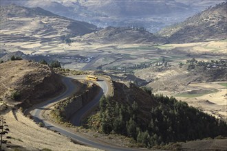 Mountain landscape, bus on a winding road in the highlands between Mekele and Lalibela, Ethiopia,