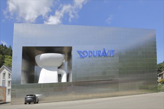 Modern building of Duravit-AG with oversized toilet bowl, oversize, XXL, size comparison, car,