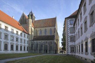 Inner courtyard with baroque illusion architecture, illusion painting, and gothic cathedral,