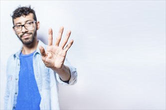 Portrait of people counting number five on isolated background. Person hand counting number five.