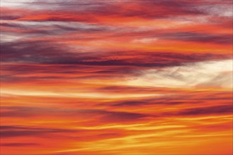 Orange-red coloured cloudy sky after sunset, cloud formation, evening sky, sunset,