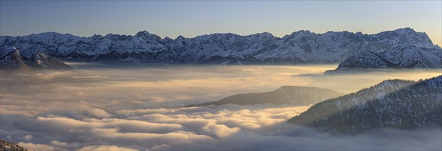 Mountain range above high fog at sunset, winter, snow, panorama, view from Laber to Zugspitze and