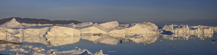 Icebergs and ice floes reflected in the water, sunny, summer, midnight sun, panorama, Jakobshavn