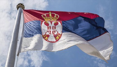 Flags, the national flag of Serbia flutters in the wind