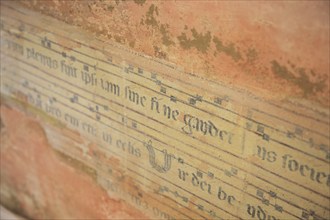 Fragment of music, fresco, of a Franciscan hymn, Assisi, Umbria, Italy, Europe