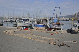 Fishing boats with fishing nets and accessories at the quay, cutter, boats, seafaring, harbour,