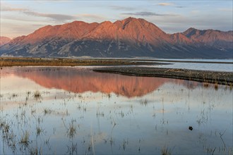 Morning light, mountains reflected in lake, autumn, wilderness, Kluane Lake, Kluane Mountains,