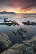 Sunset in winter at Skagsanden, rock formations on the beach at Flakstad, Flakstadøy, Lofoten,