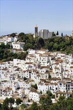 Typical white village of Casares, houses and church on a hill, View of the village, Route of the