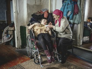 Mischa (17) suffers from spastic paralysis. Grandmother Irina cares for the child and looks after