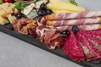 Appetizer, assortment, set, sausage, and cheese, on a wooden board, top view, no people