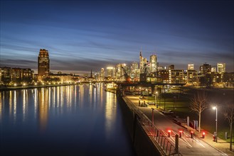 Skyline in the evening, skyscrapers of the banking district, historic harbour cranes at Weseler