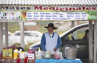 Peruvian woman sells medicine against cancer and diabetes at the indigenous market in Chinchero,