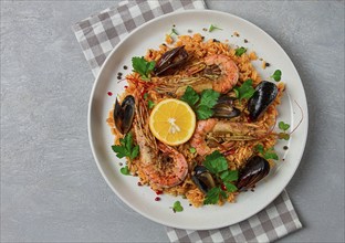 Seafood paella, shrimp and mussels risotto, rice, homemade, top view, no people