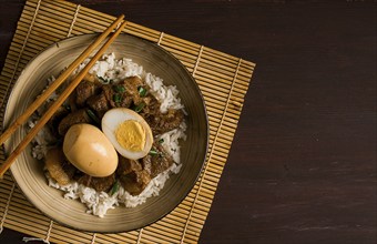 Stewed eggs, with pork belly, and rice, chinese food, homemade, selective focus, rustic, no people