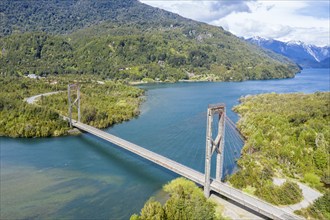 Aerial view of suspension bridge over river Rio Yelcho, early spring, Chile, South America