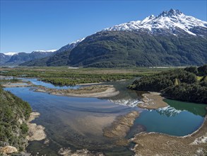 The widely branching arms of river Rio Ibanez, near Villa Cerro Castillo, reflections on the water,