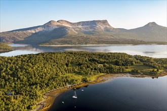 Aerial view over the fjord Efjord south of Narvik, seen at sunset, leisure boats anchor, holiday