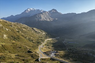 Aerial view of Simplon mountain pass, drone shot, camper vans park near old Spittel, Switzerland,