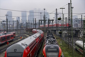 Railway tracks with regional trains, after freezing rain, in front of Frankfurt main station,