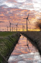 Wind farm near the East Frisian town of Norden, east of the town, sunset, Lower Saxony, Germany,