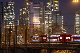 Railway tracks in front of the main railway station in Frankfurt am Main, skyline of skyscrapers in