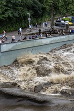 Weir of the Lake Baldeney in Essen, the masses of water roar through the open weirs, spectators,