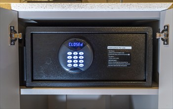 Room safe in a hotel, keypad for entering a 6-digit numerical code to lock the safe for depositing