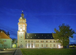 Ehrenstein Castle, a well-preserved Renaissance castle, with castle garden, illuminated at dusk.