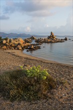 Lonely beach with granite rocks, sunrise, Spiaggia Poltu Manzu, Capo Ceraso, near Olbia, Sardinia,