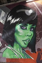 Portrait of a woman with a green face, extraterrestrial creature, Martian, mural in a subway, urban