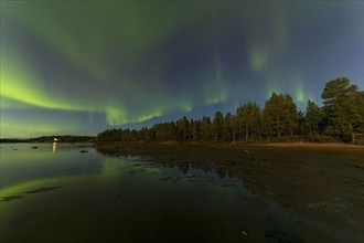 Northern lights, (Aurora borealis) at a lake near Kiruna, September 2024, Lapland, Sweden, Europe