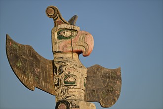 Kwakwakawakw totem pole at the cemetery in Alert Bay, Cormorant Island, British Columba, Canada,