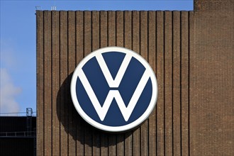 Large VW logo on the old cogeneration plant, Volkswagenwerk Wolfsburg, main plant of Volkswagen AG,