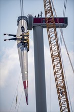 Erection of an Enercon E-160 wind turbine, assembly of the first blade, 4 turbines with a total