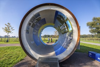 Original sewer pipe element of the Emscher sewer as an information stand in Emscherland, a new