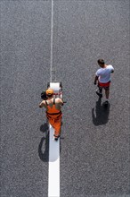 Marking work after the renewal of the road surface on the A40 motorway between the Kaiserberg