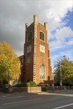 Red brick clock tower of parish church of Saint Paul, Hills Road, Cambridge, Cambridgeshire,