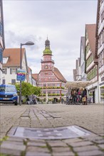 Historic market square with half-timbered architecture and lively shopping street, Kirchheim Teck,