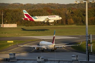 Eurowings Airbus A319-132, landing at Cologne-Bonn Airport, Eurowings Boeing 737-8GJ, waiting on