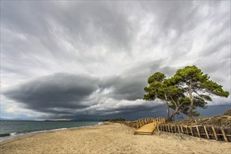 Empty beach, jetty, dramatic, gloomy sky, weather, clouds, stormy, stormy, coast, Mediterranean,