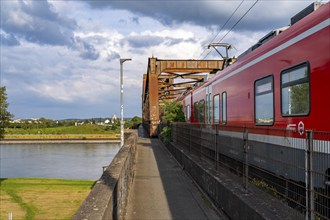 The railway bridge Duisburg-Hochfeld-Rheinhausen, over the Rhine, regional trains and many goods