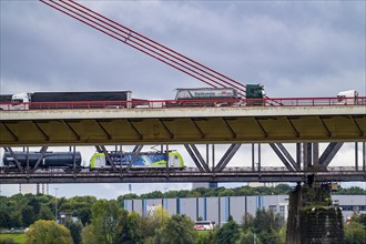 The Beeckerwerth Rhine bridge of the A42 motorway, truck traffic, behind it the Haus-Knipp railway