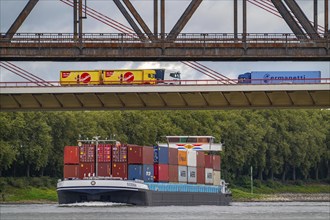 The Beeckerwerth Rhine bridge of the A42 motorway, truck traffic, in front of it the Haus-Knipp