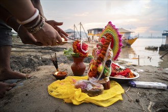 Devotees offer prayers to the Ganesha idol before immerse in the Brahmaputra river, during Ganesh