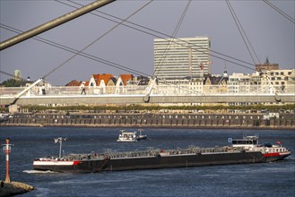 Cargo ships on the Rhine near Düsseldorf, bridge over the Media Harbour, Oberkassler Rhine Bridge,